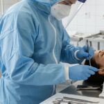 An embalmer performing restorative work on a deceased individual, highlighting the unseen expertise in funeral services in Singapore.